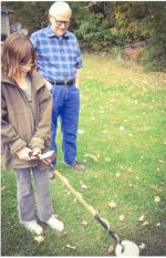 Abigail metal detects with Compadre, Grandpa Todd watching, 2016 001.jpg