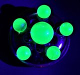 U glass marbles on 3 in diameter Carnival glass flower frog unfiltered LW UV 365 nm.jpg