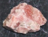 Calcite, salmon colored, Sterling Hill Mine, Odgensburg, Sussex Co., NJ, FOV=2 in., natural ligh.JPG