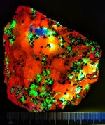 Calcite, Willemite, and sparse Hardystonite, Franklin, Sussex Co., NJ, SW 254nm.jpg
