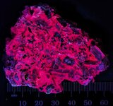 K-feldspar, alkali syenite, Granite Mtn Qy#1, Pulaski Co., AR, SW 254nm, S. Bonney, JMH.jpg