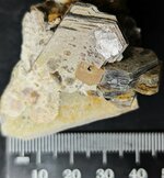 Fluorapatite on mica and feldspar, Pakistan, natural light.jpg